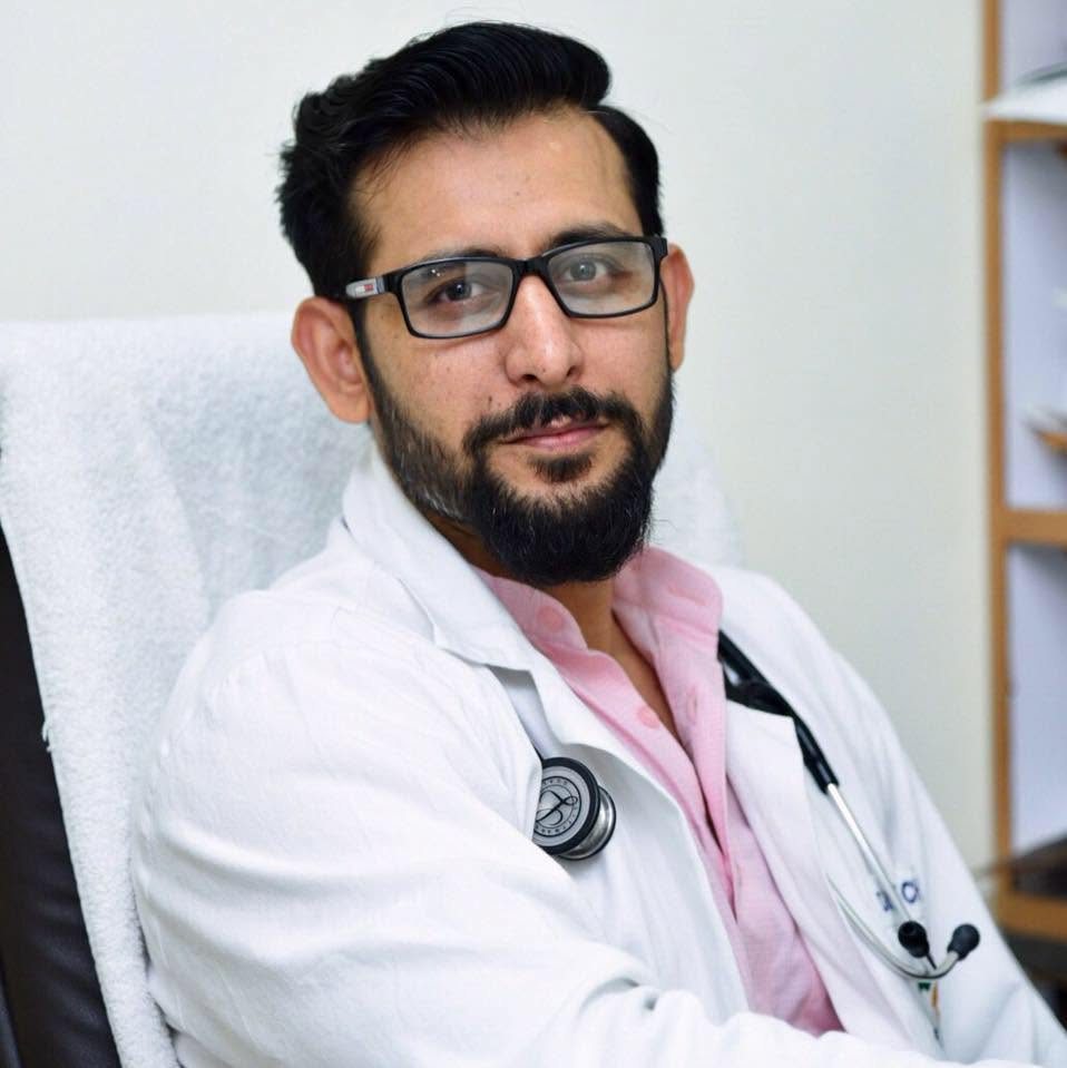 Dr. L.K. Chaudhary at his clinic desk