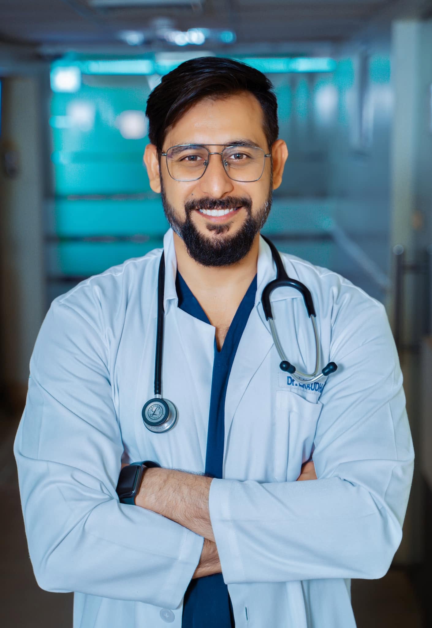 Dr. L.K. Chaudhary, pulmonologist, in white coat with stethoscope